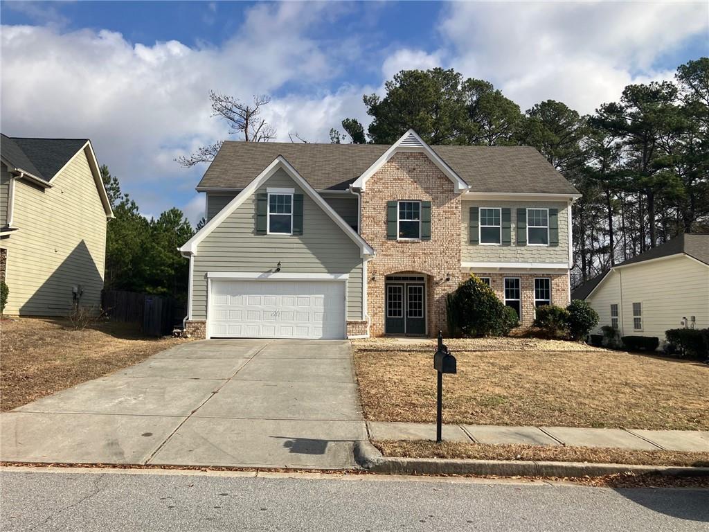 2808 Brookford Lane Southwest Atlanta, GA 30331 - Photo 2 of 25 a front view of a house with garage