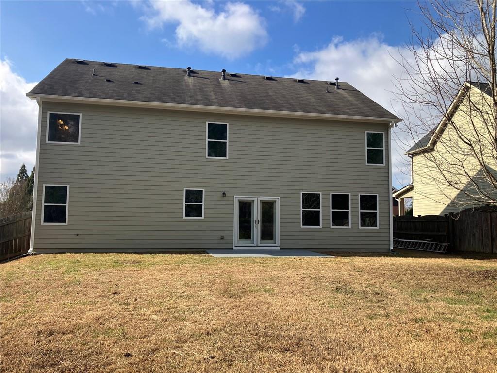 2808 Brookford Lane Southwest Atlanta, GA 30331 - Photo 21 of 25 a front view of a house with a yard
