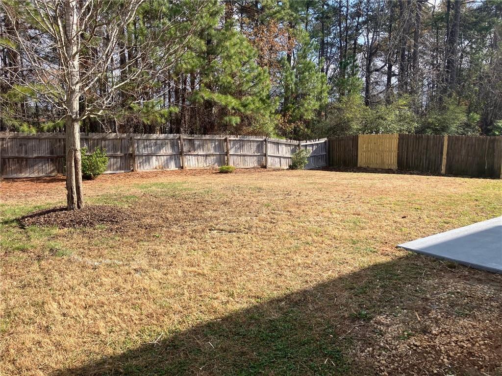 2808 Brookford Lane Southwest Atlanta, GA 30331 - Photo 22 of 25 a house with trees in front of it