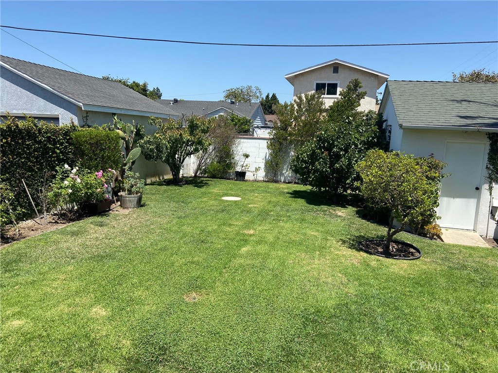 3603 148th Place Hawthorne, CA 90250 - Photo 16 of 19 a front view of a house with a yard