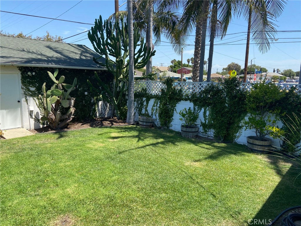 3603 148th Place Hawthorne, CA 90250 - Photo 17 of 19 a view of a porch with a table and chairs under an umbrella