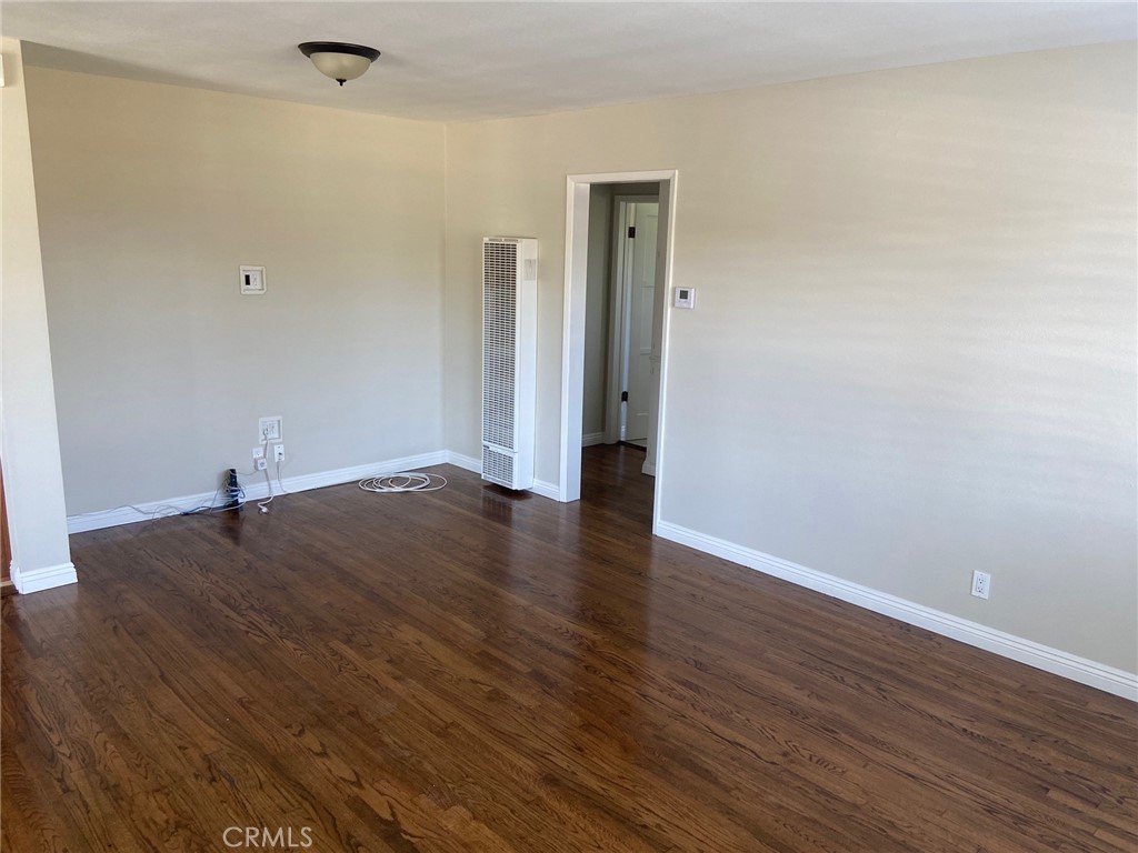 3603 148th Place Hawthorne, CA 90250 - Photo 3 of 19 an empty room with wooden floor