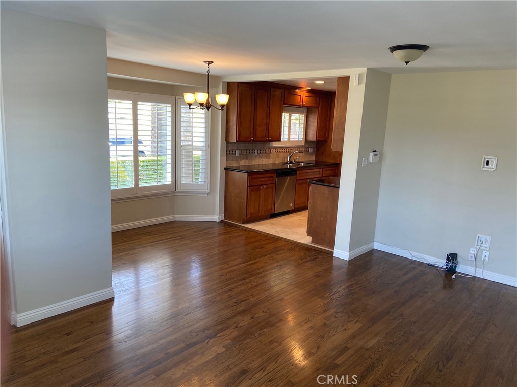 3603 148th Place Hawthorne, CA 90250 - Photo 4 of 19 an empty room with wooden floor and windows
