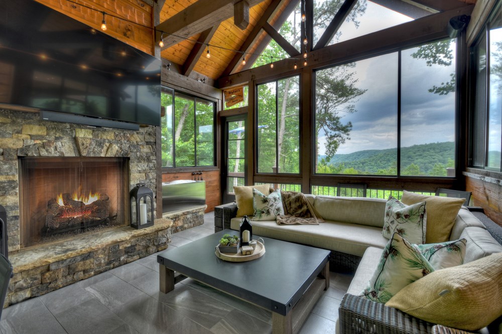 436 Geronimo Road Cherry Log, GA 30522 - Photo 20 of 72 a living room with furniture and a fireplace
