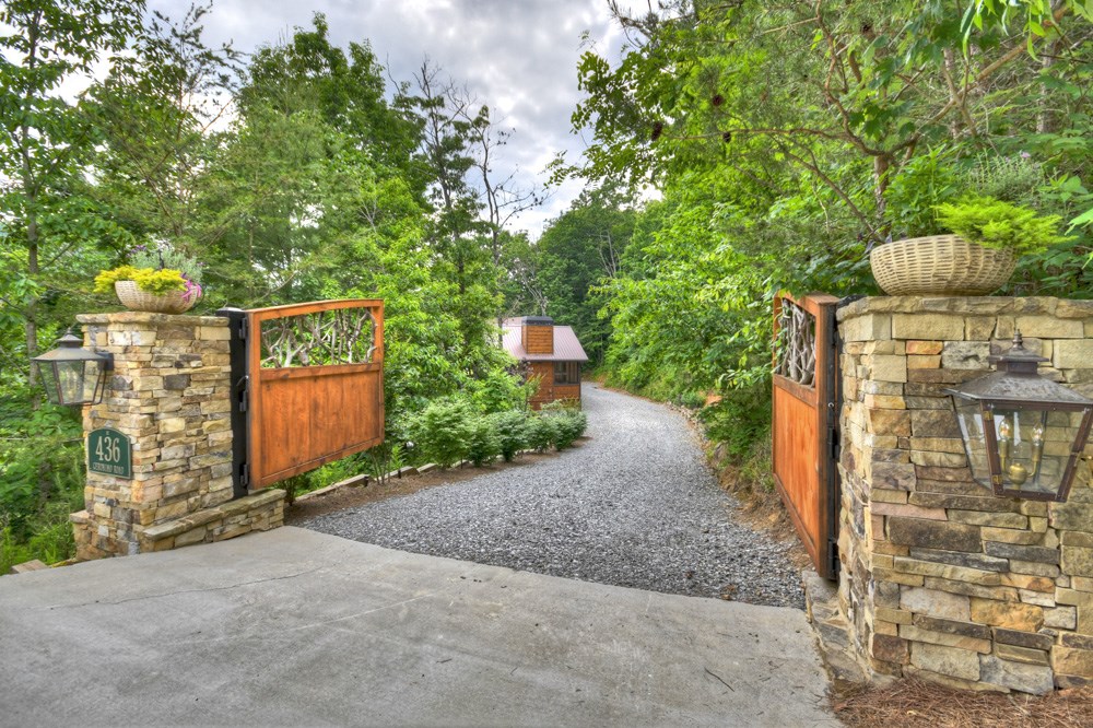 436 Geronimo Road Cherry Log, GA 30522 - Photo 2 of 72 a pathway of a house with a yard and wooden fence