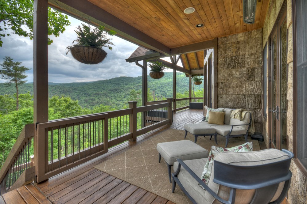 436 Geronimo Road Cherry Log, GA 30522 - Photo 25 of 72 a balcony with couple of chairs and wooden floor