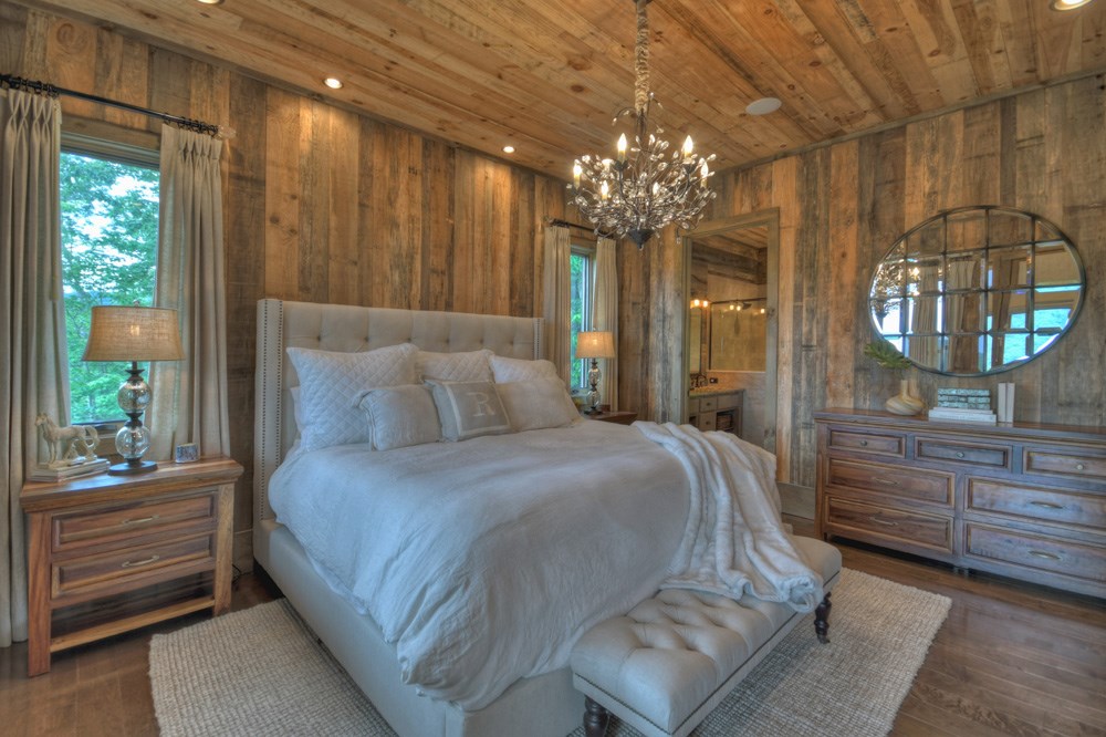 436 Geronimo Road Cherry Log, GA 30522 - Photo 30 of 72 a bedroom with a bed mirror and a window