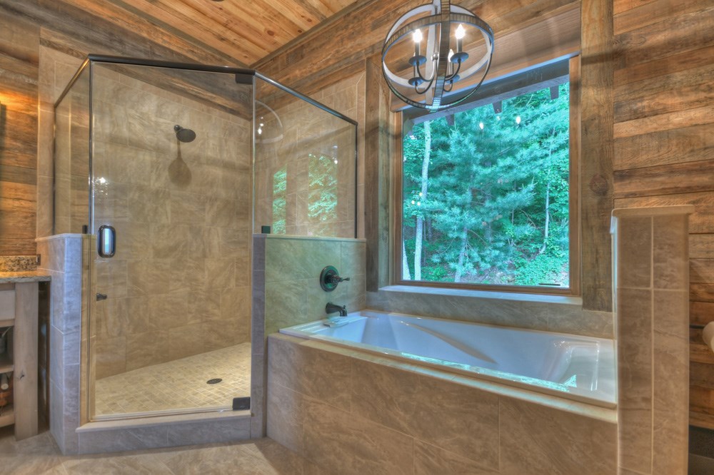 436 Geronimo Road Cherry Log, GA 30522 - Photo 34 of 72 a bathroom with a bathtub and a shower