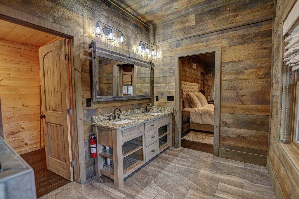 436 Geronimo Road Cherry Log, GA 30522 - Photo 55 of 72 a bathroom with a sink and a mirror