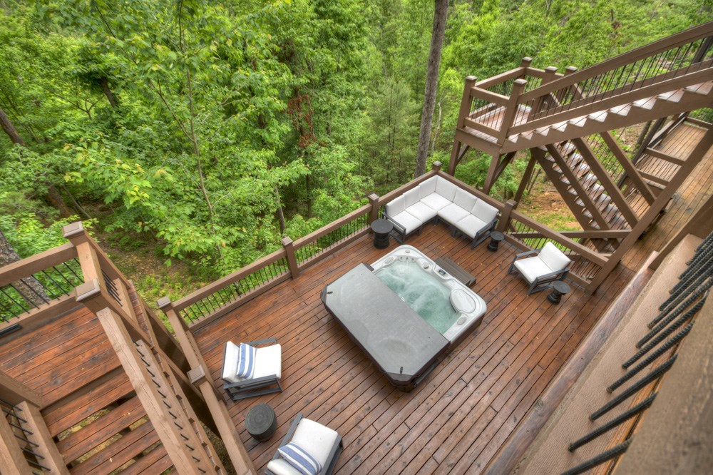 436 Geronimo Road Cherry Log, GA 30522 - Photo 61 of 72 a wooden floor with glass top table and chairs