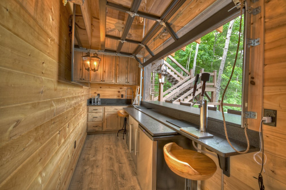436 Geronimo Road Cherry Log, GA 30522 - Photo 63 of 72 a bathroom with a sink a mirror and next to a window