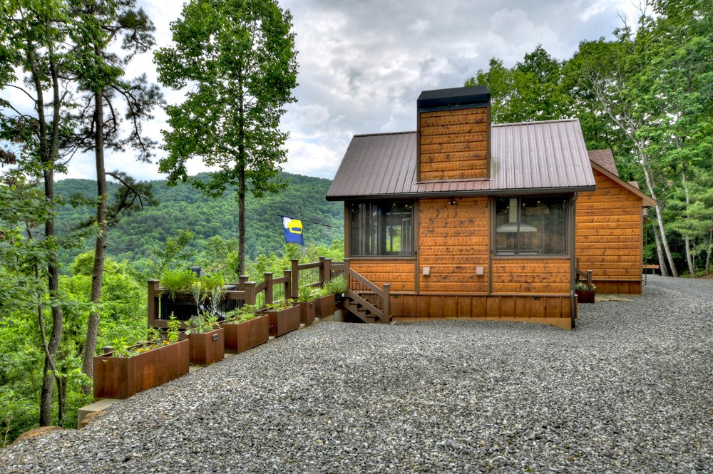 436 Geronimo Road Cherry Log, GA 30522 - Photo 69 of 72 a front view of a house with a garden