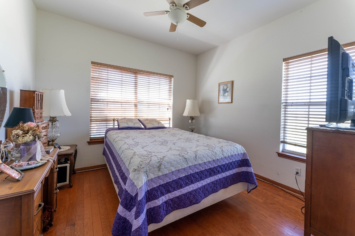 2542 Witter Road Lockhart, TX 78644 - Photo 11 of 40 a bed sitting in a bedroom next to a window