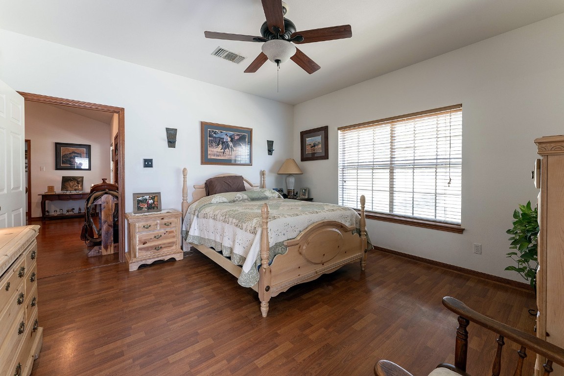 2542 Witter Road Lockhart, TX 78644 - Photo 36 of 40 a bedroom with a bed wooden floor and window