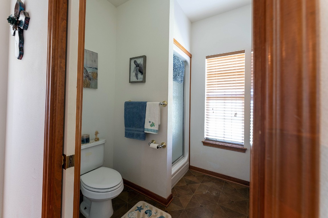 2542 Witter Road Lockhart, TX 78644 - Photo 39 of 40 a bathroom with a toilet sink and window