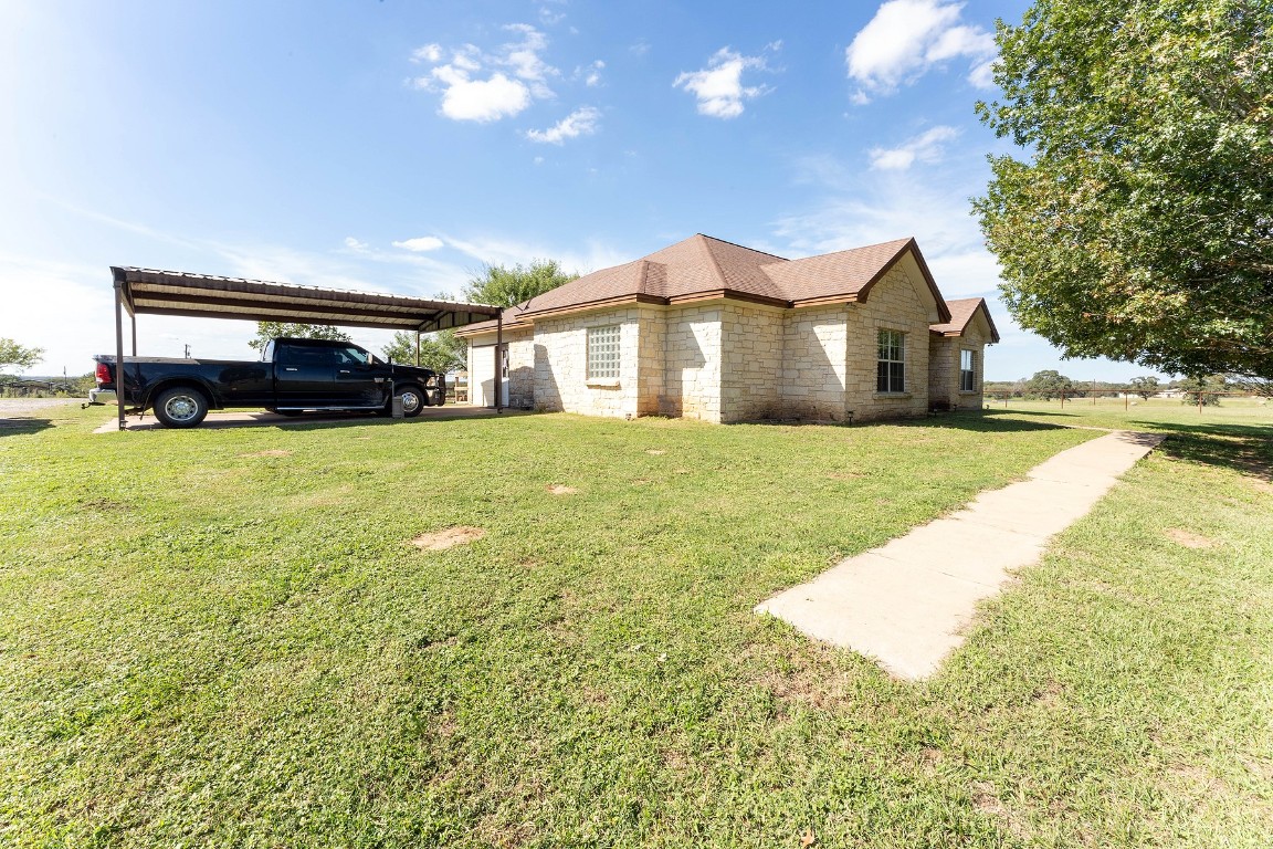 2542 Witter Road Lockhart, TX 78644 - Photo 5 of 40 a view of a house with a yard and garage
