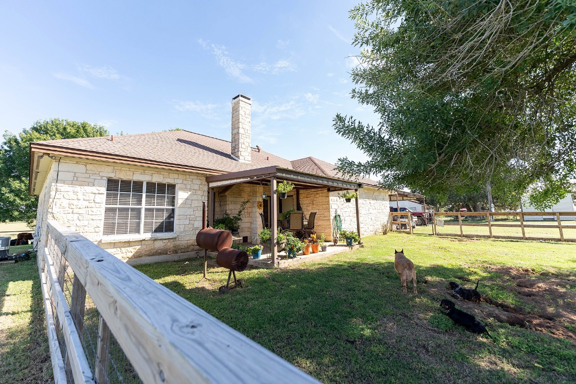 2542 Witter Road Lockhart, TX 78644 - Photo 9 of 40 a front view of a house with garden
