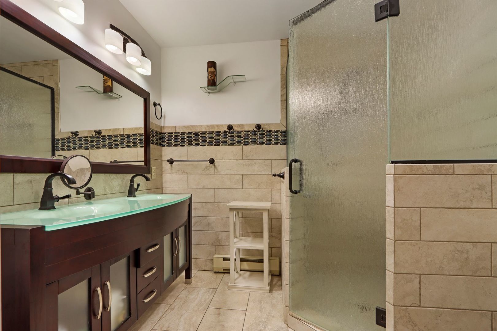 W4226 West End Road Lake Geneva, WI 53147 - Photo 24 of 44 a bathroom with a granite countertop sink a mirror and shower