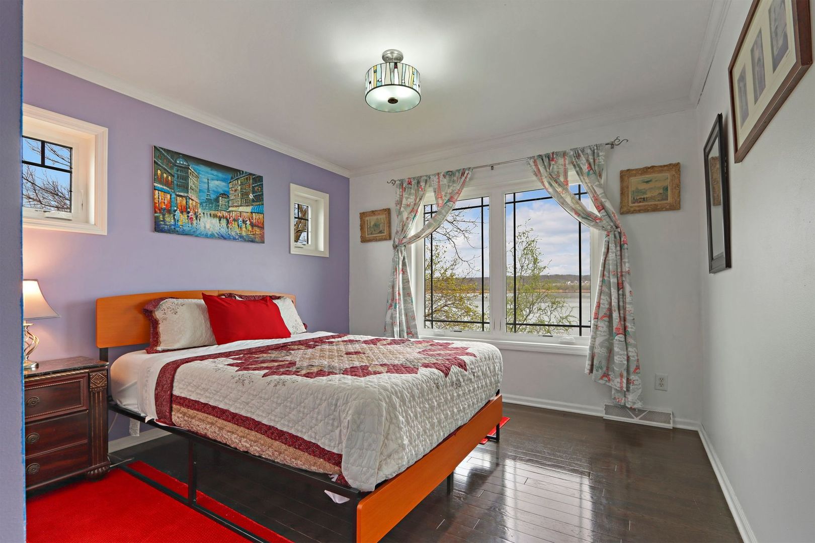 W4226 West End Road Lake Geneva, WI 53147 - Photo 25 of 44 a bedroom with a bed and a lamp next to a window
