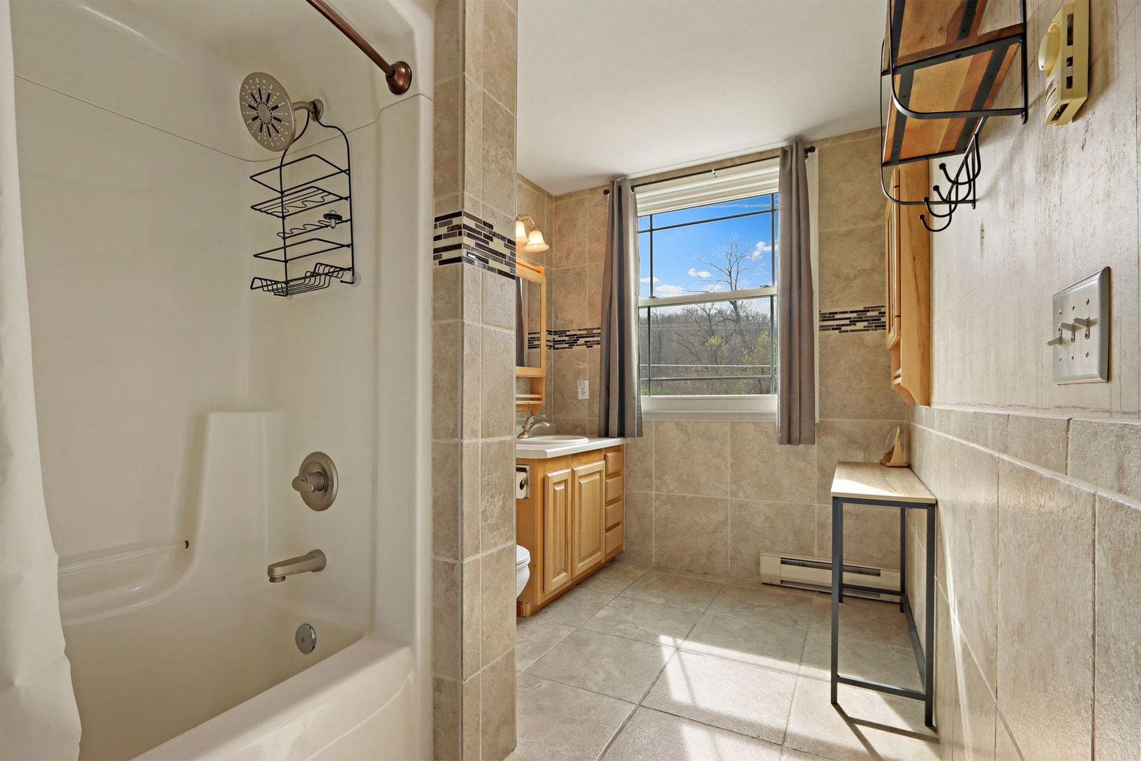 W4226 West End Road Lake Geneva, WI 53147 - Photo 27 of 44 a bathroom with a bathtub a sink and a shower