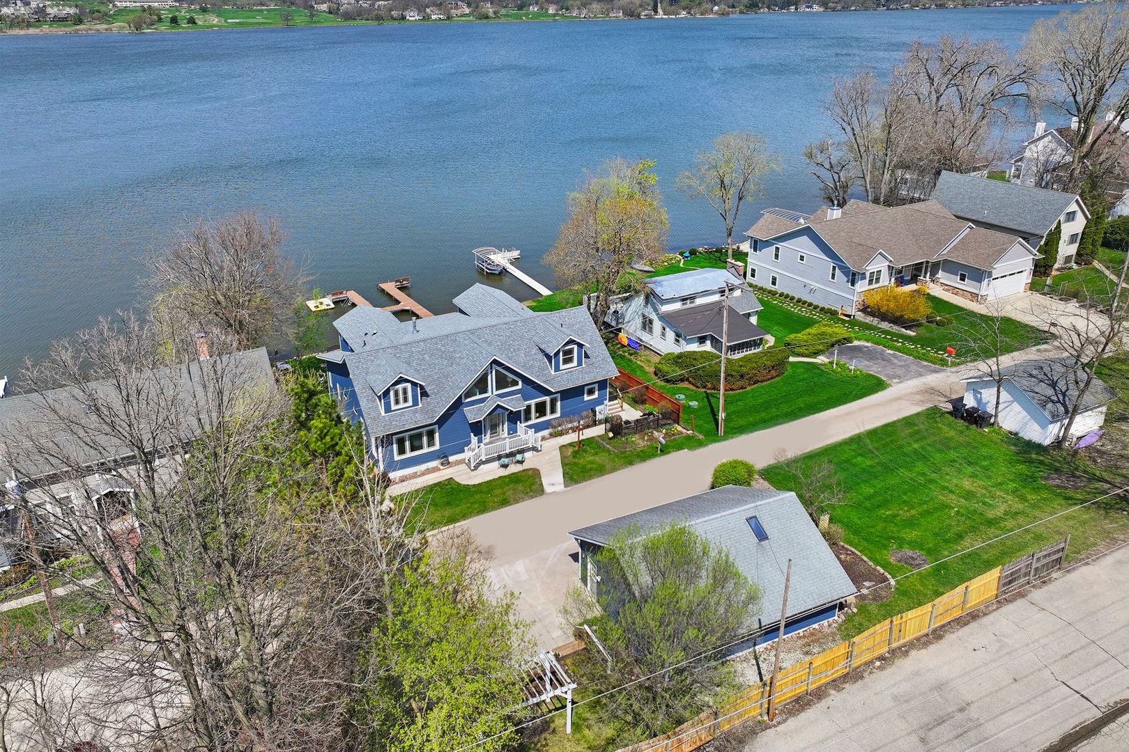W4226 West End Road Lake Geneva, WI 53147 - Photo 42 of 44 an aerial view of a house with a yard and lake view