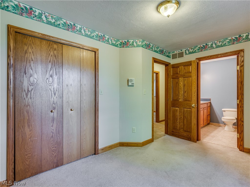 6644 Red Brush Road Ravenna, OH 44266 - Photo 20 of 35 The master bedroom has double closets and a full master bathroom.