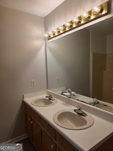 a bathroom with a sink and a mirror