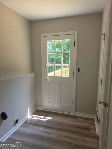 a view of an empty room with a window