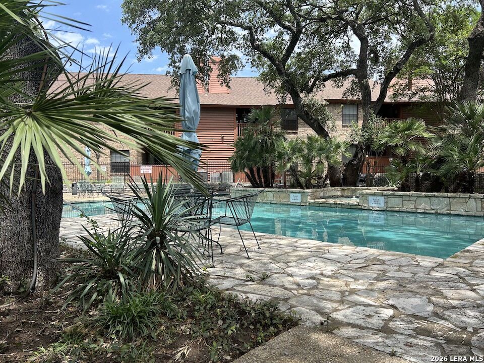 13018 Heimer Road, Unit 710 San Antonio, TX 78216 - Photo 3 of 27 a view of a park with a large tree