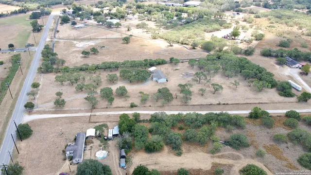 an aerial view of a houses with outdoor space