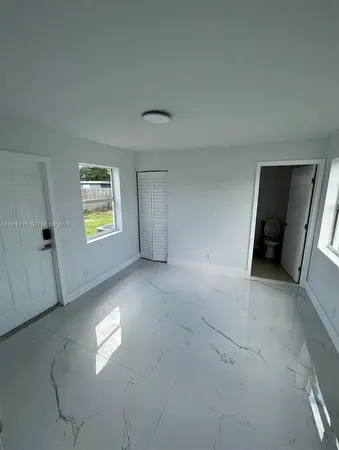 a view of an empty room with a window