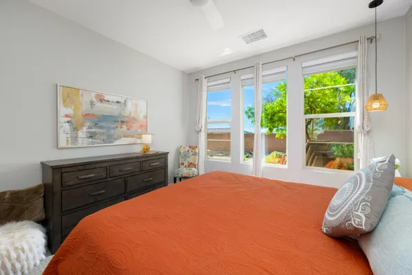a bathroom with double sink and a mirror