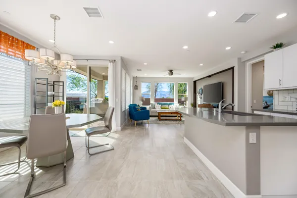 a kitchen with sink refrigerator and cabinets