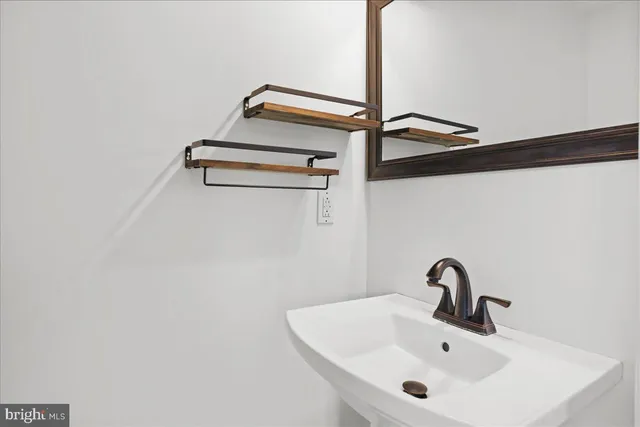 a view of a room with a window and wooden floor