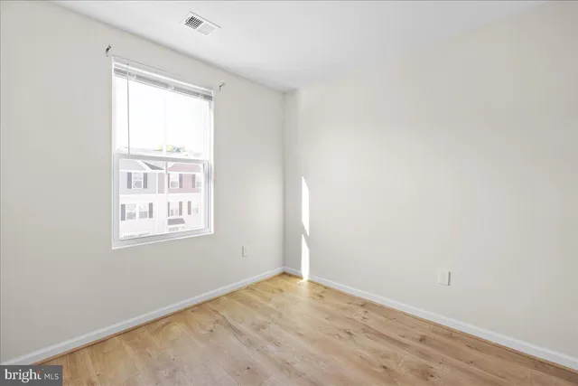 a view of a house with wooden deck
