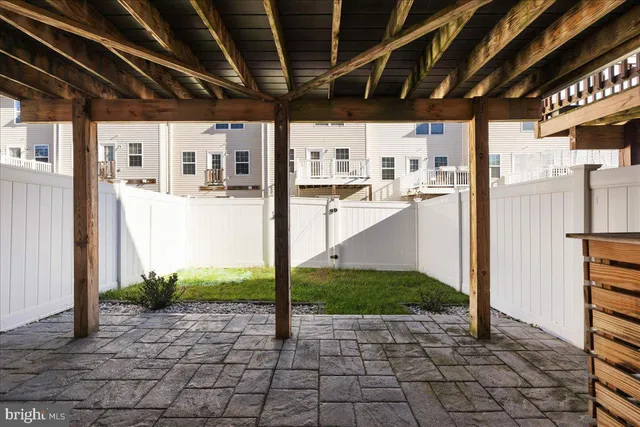 a front view of a residential apartment building with parking space