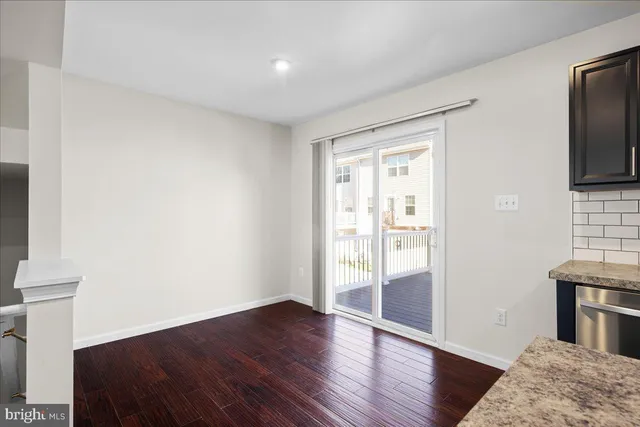 a view of a house with wooden deck
