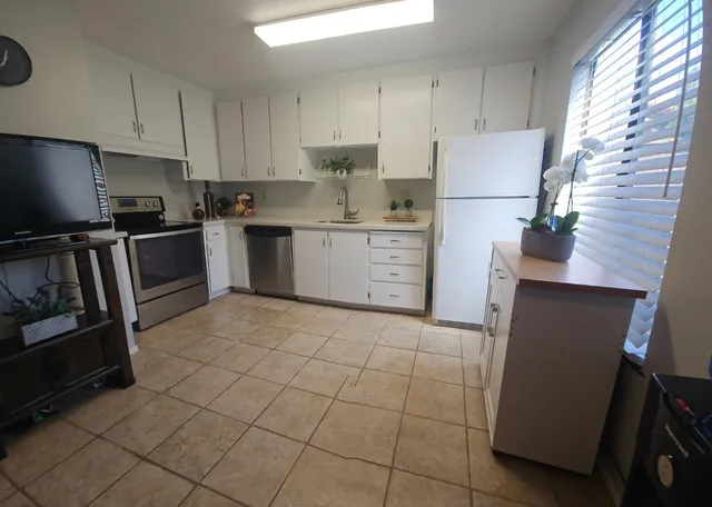 a living room with furniture and a table