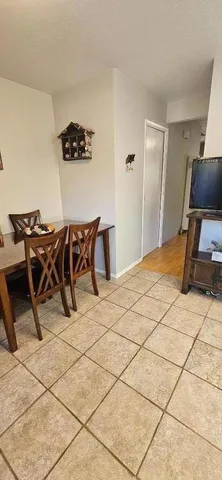 a bed room with a chair and furniture