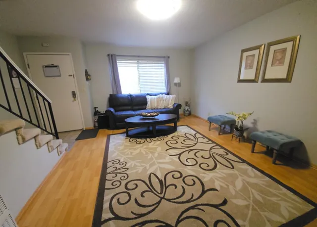 a view of a living room and kitchen