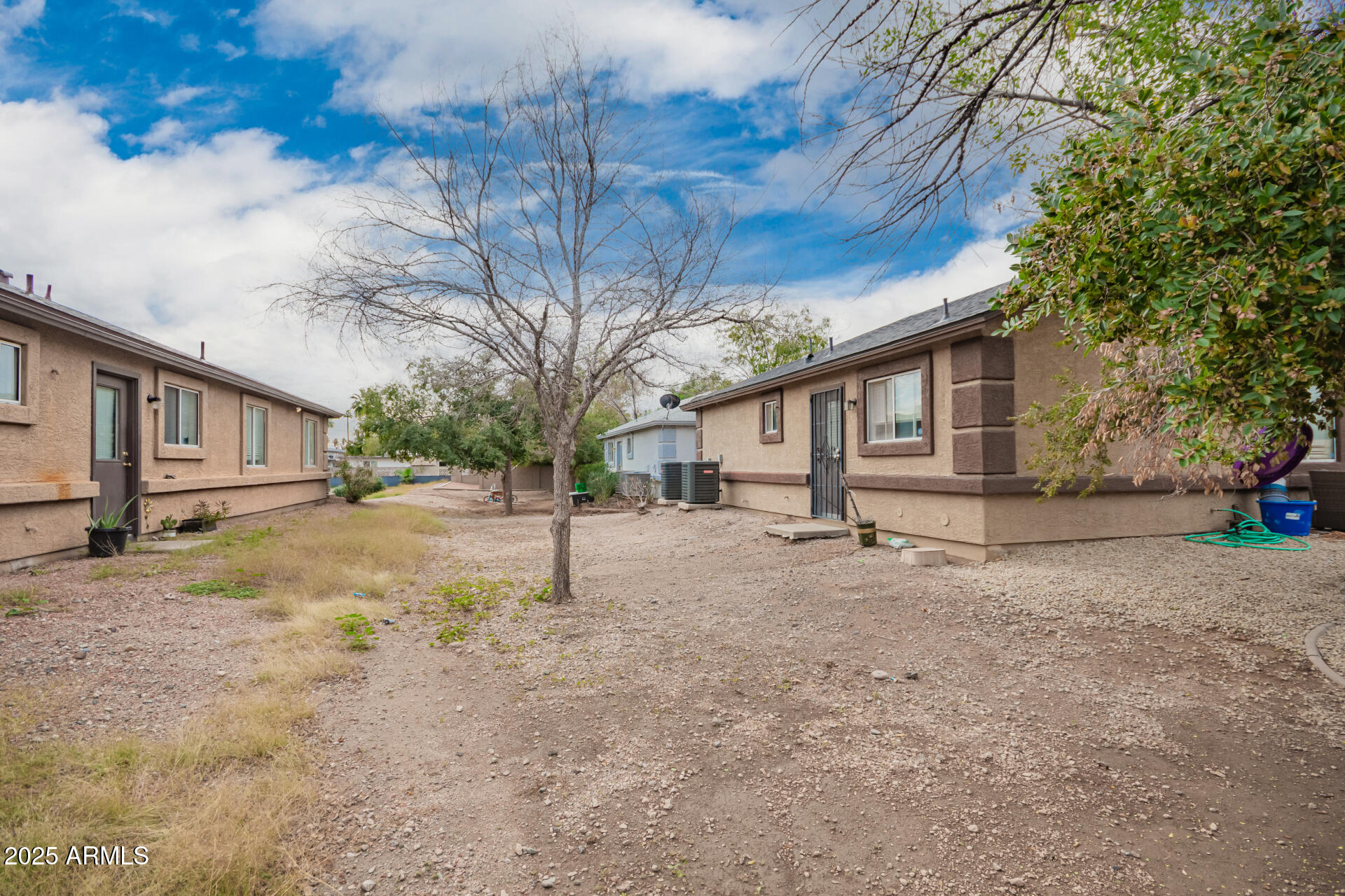 7549 North 21st Avenue Phoenix, AZ 85021 - Photo 5 of 9 a house with trees in front of it