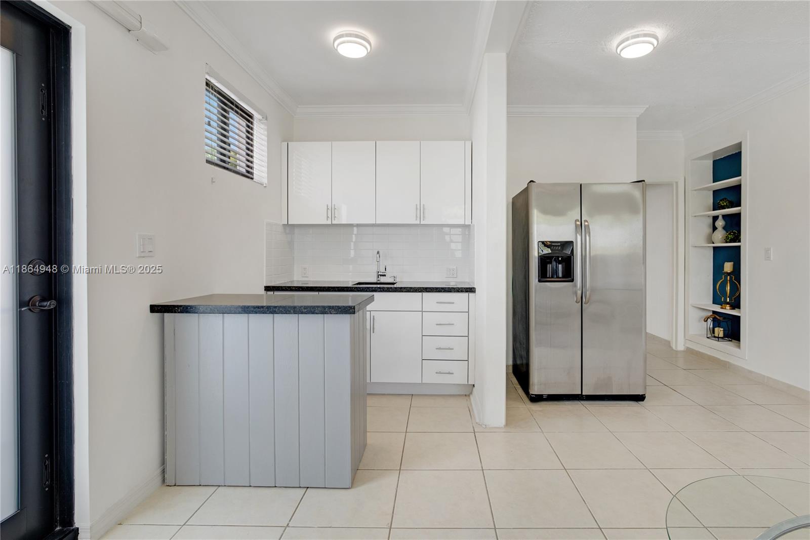 2022 Southwest 82nd Court, Unit B Miami, FL 33155 - Photo 4 of 15 a kitchen with cabinets and stainless steel appliances