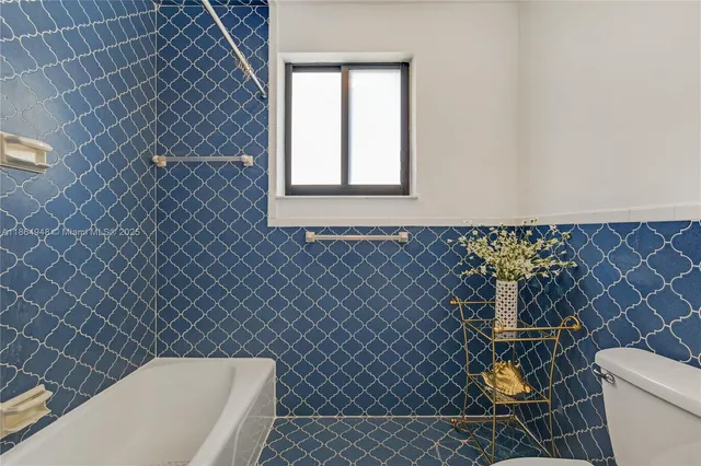 a bathroom with a toilet and a sink