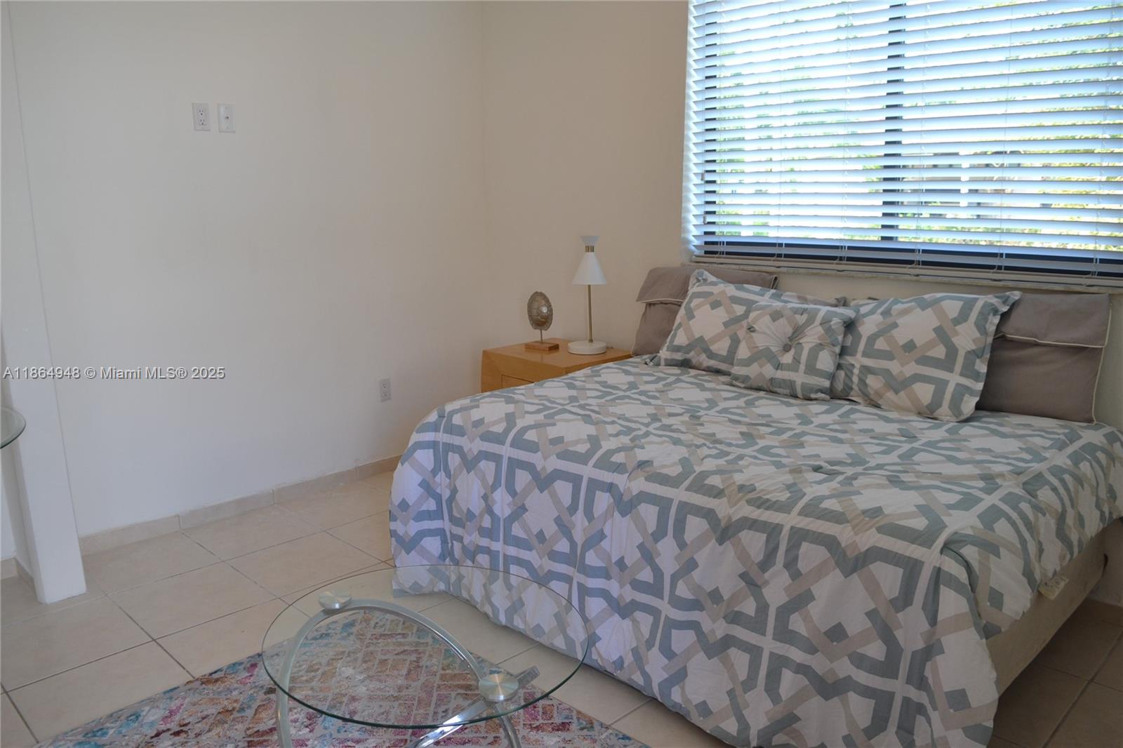 2022 Southwest 82nd Court, Unit B Miami, FL 33155 - Photo 10 of 15 a bedroom with a bed and window