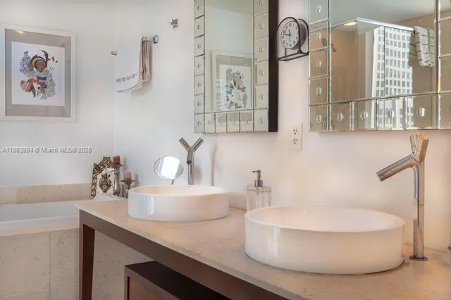 a bedroom with furniture and a flat screen tv