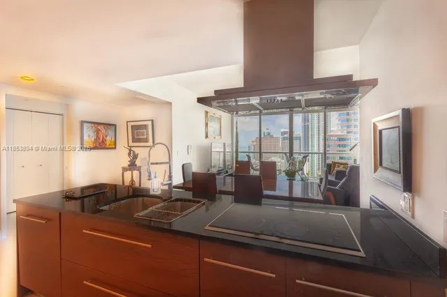 a kitchen with a sink and large window