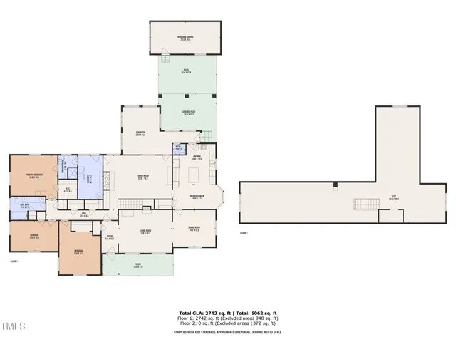 a view of a house next to a big yard and large trees