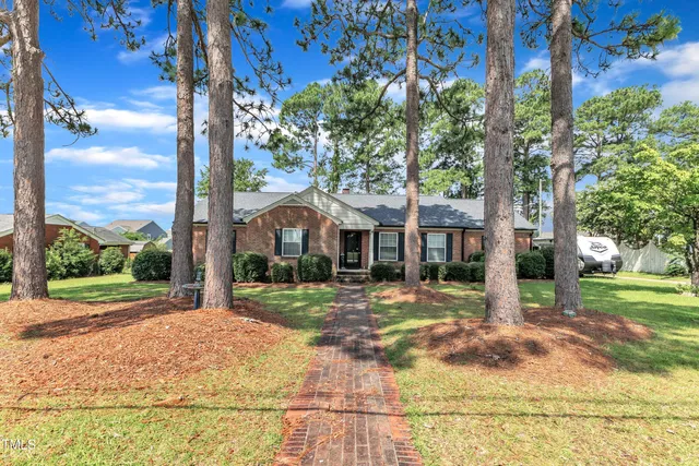 a picture of a bathroom with a bathtub