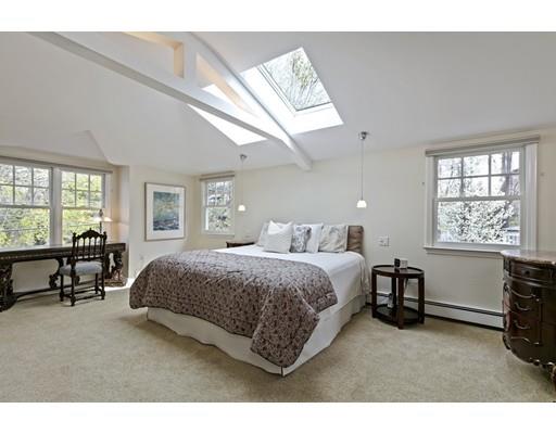 140 Cedar Street Lexington, MA 02421 - Photo 18 of 29 a bedroom with a bed a table and windows