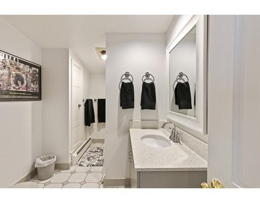 140 Cedar Street Lexington, MA 02421 - Photo 25 of 29 a bathroom with a sink and mirror with toilet